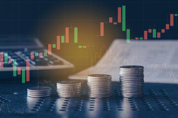 Stack of money coin on accounting sheet with trading graph, Business and Finance concept. 