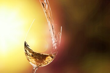 White wine being poured in wineglass
