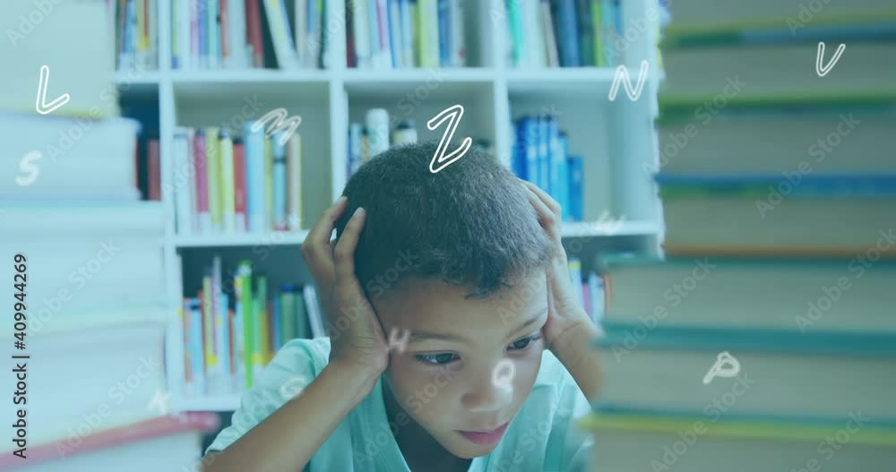 Aufkleber digital composition of multiple alphabets floating against boy covering his ears in library
