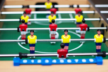 Fototapeta premium Details of a table soccer game. Table football is a toy for children. Close up. Selective focus