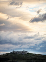 Naklejka premium Dramatic clouds at a rock called Hölzlstein in Burgenland