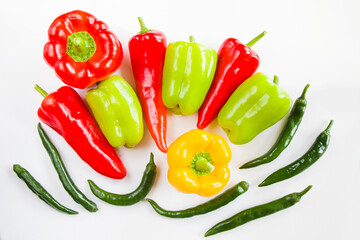 All colors bell peppers and green pepper on the white background, colorful vegetables