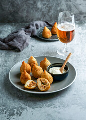 coxinha - popular food in Brazil consisting of chopped or shredded chicken meat covered in dough