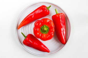 Bell pepper on the plate, white background and high angle view
