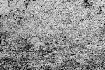 Texture of a concrete wall with cracks and scratches which can be used as a background