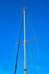 Sailboat mast on blue sky background. Sailing background photo. Boat masts. Sailboat background photo. Summer vacation. 