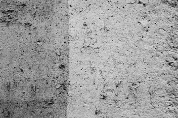 Texture of a concrete wall with cracks and scratches which can be used as a background