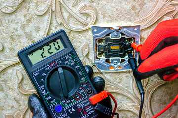 Repair of the socket, socket. Tools, voltage measuring devices. selective focus.