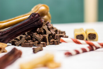 Dog bone for chewing on a green background