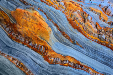 Texture patterns and colors on a cliff of a beach in Asturias