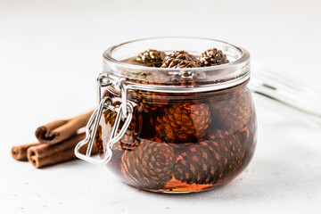 Siberian pine cone jam in a jar. Space for text.