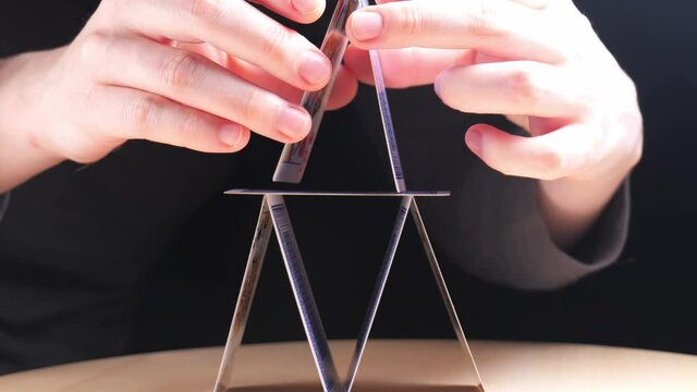 building a house of cards. House of cards symbol of financial pyramid and instability