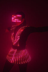 Sexy disco dancer dancing in a UV suit to music. Parties and dances.
