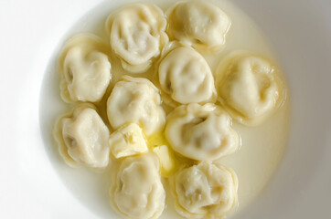 Russian pelmeni meat Dumplings with butter.