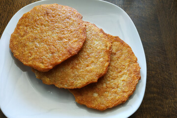 Crispy fried potato pancakes, vegetarian food, potato dish.