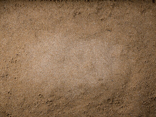 Sand background. The middle part is dry and the edge is wet sand.