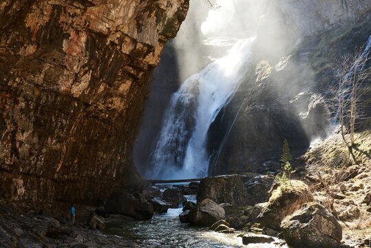 Scenic view of waterfall in highland area in Pyrenees mountains on sunny day in Ordesa Valley
