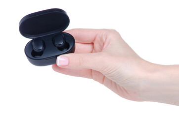Black wireless headphones in hand on white background isolation