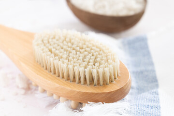 Sea salt , towel, massage wooden brush on white background