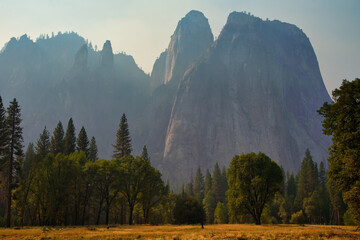 Peaceful landscape Yosemite Valley with massive cliffs and trees