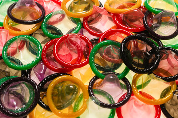 Colorful condoms background.