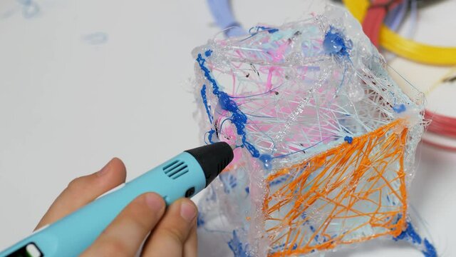 3D pen in a child's hand.