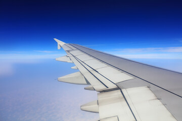 Fototapeta premium Wings of large passenger aircraft, flying at high altitude, South China