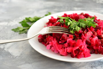 venaigrette on a white plate with a fork