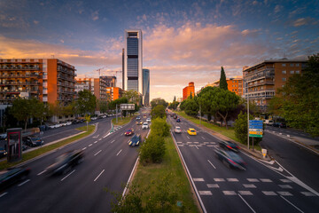Magnificent view of asphalt road with traffic cars at evening in Madrid
