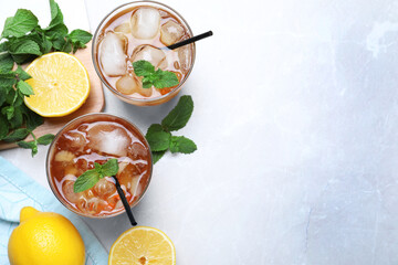 Delicious iced tea on light table, flat lay. Space for text