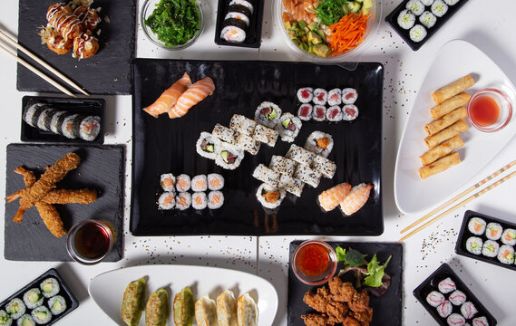 From above of various sushi and rolls placed on table in Asian restaurant