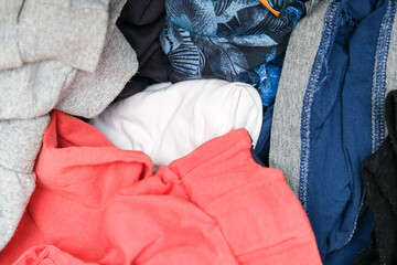 Trash, dirt, mess in the dresser drawer, different clothes, heaps of things