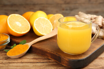 Immunity boosting drink and ingredients on wooden table