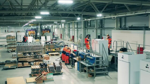 Industrial production factory interior. Refrigeration factory unit with manual assembly of fridges