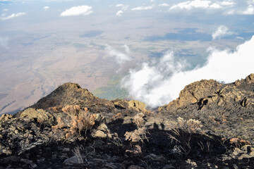 Scenic rock formations above the clouds at Mount Meru, Tanzania