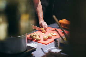 Chefs preparing beautiful dishes in French restaurant's kitchen