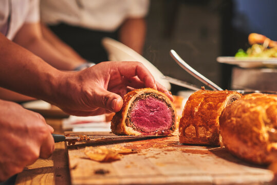Chefs preparing beautiful dishes in French restaurant's kitchen