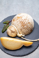 Italian semi hard matured caciocavallo cheese, handmade and aged in natural underground caves in...