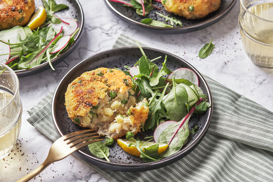 Smoked mackerel fishcakes served with a rocket, spinach salad