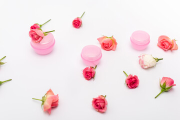 pink tea roses and delicious macarons on white