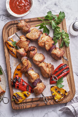 Grilled pork kebab with red and yellow pepper