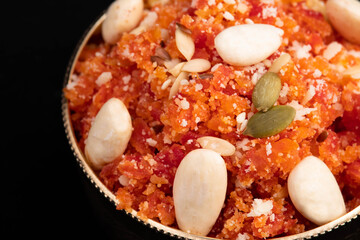 Detailed Closeup Of Indian Mithai Gajar Ka Halwa Halva Or Carrot Pudding Gajrela Halua Made Of Grated Carrots Milk Cream Meetha Mava Sugar Desi Ghee Khoya Mawa Badam Decorated With Almonds Dry Fruits