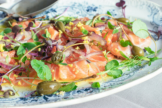 Tasty Salmon Sashimi Carpaccio Salad with Capers and Onion