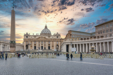 Naklejka premium Tourists in Saint Peter's Basilica and square at sunset, Vatican City, Rome, Italy