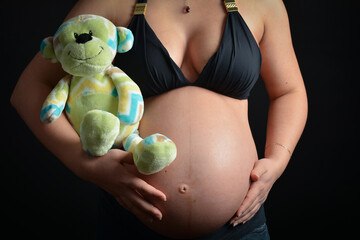Pregnant belly with plush monkey toy 