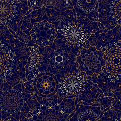 Seamless pattern with golden mandala on dark blue background. Arabic golden ornament for printing on fabric or paper.