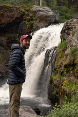 Hiker with Waterfall in Yellowstone National Park