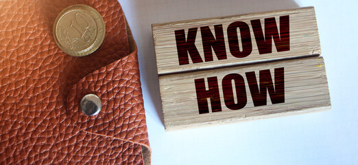 Know How words on wooden block. Business technologies and education concept