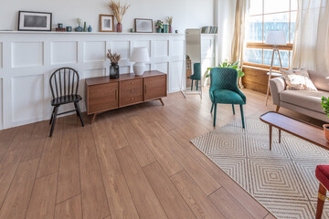 Vintage studio apartment interior in light colors in old style. huge room with large windows with a...