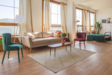 Vintage studio apartment interior in light colors in old style. huge room with large windows with a...